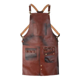 Utility pockets and reinforced rivets on a waxed brown leather work apron